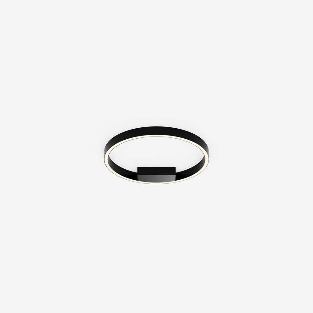 Plafonnier circulaire noir fixé au plafond, anneau lumineux et boîtier central