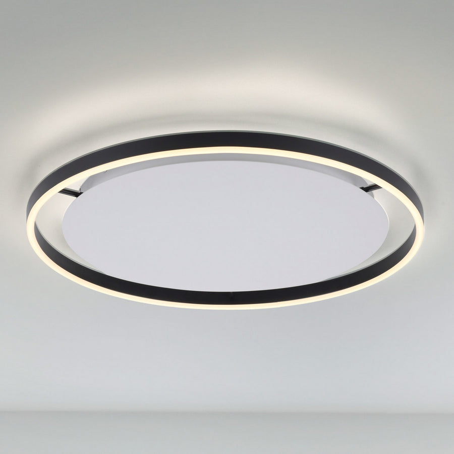 Plafonnier LED circulaire anthracite et blanc, allumé, vu de face sur fond clair.