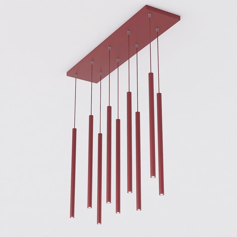 Vue en biais montrant la platine rectangulaire et les neuf câbles avec tubes rouges.
