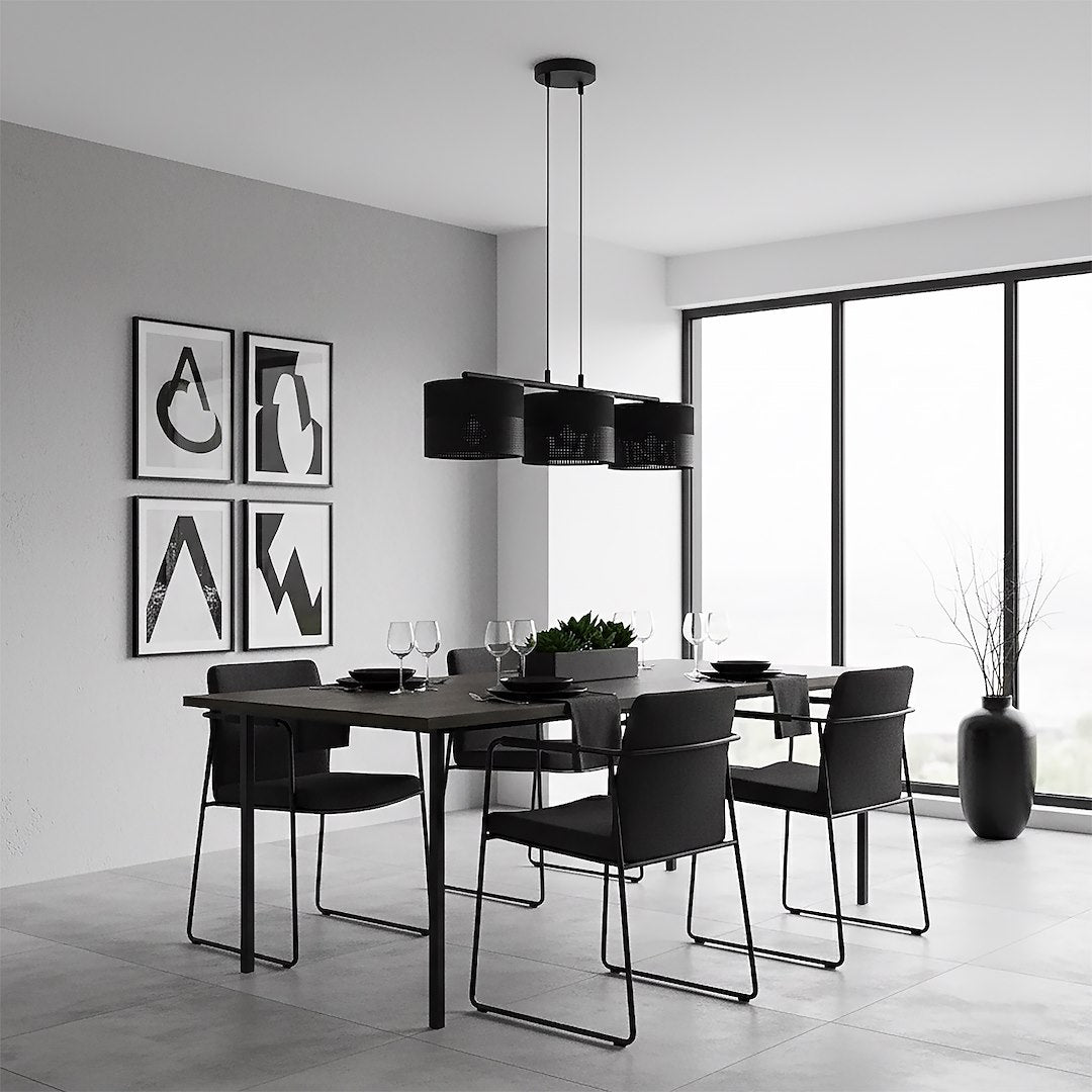 Salle à manger minimaliste noire et blanche, trois cylindres suspendus au-dessus de la table