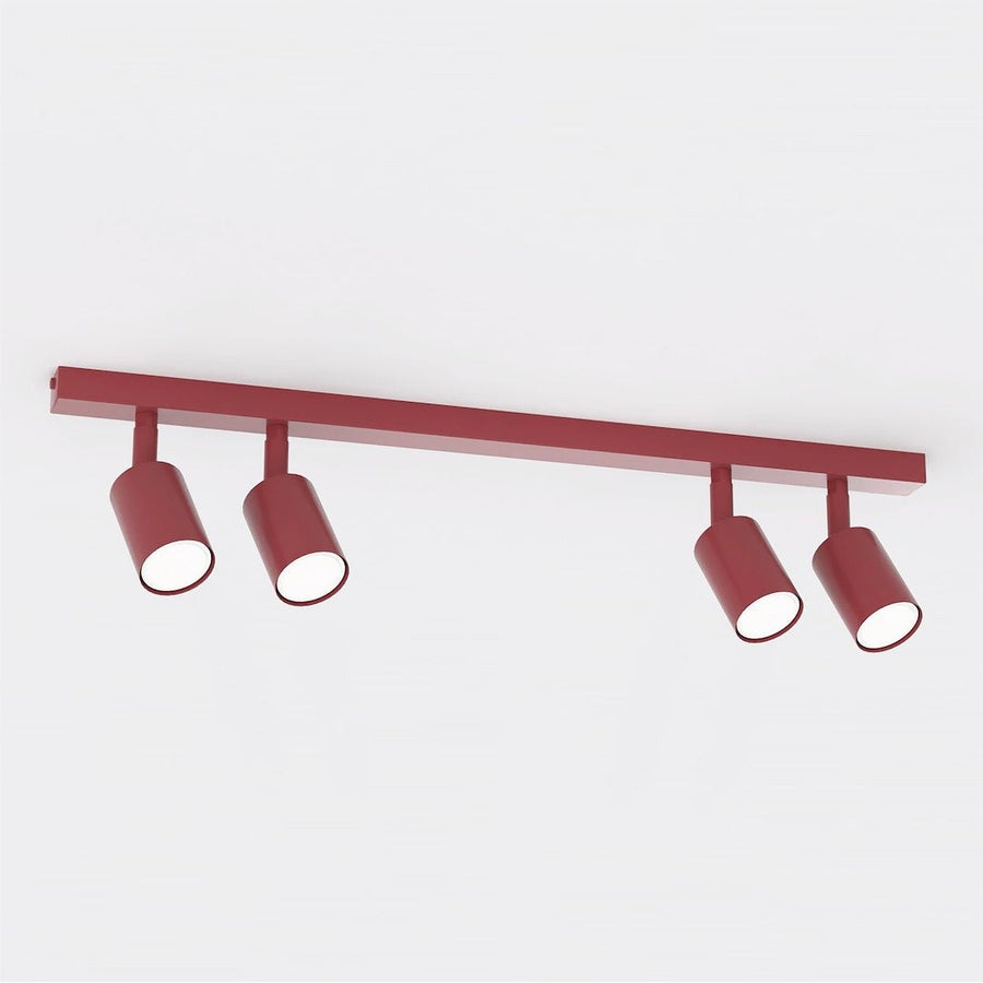 Plafonnier rouge bordeaux avec quatre spots cylindriques orientables, vue de face sur fond blanc