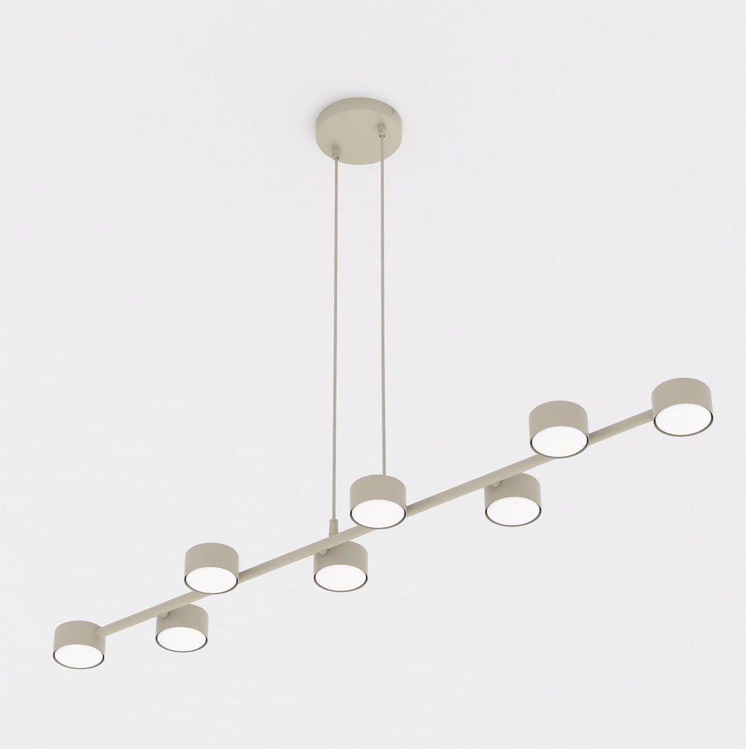 Vue de face du luminaire beige à huit spots cylindriques alignés.