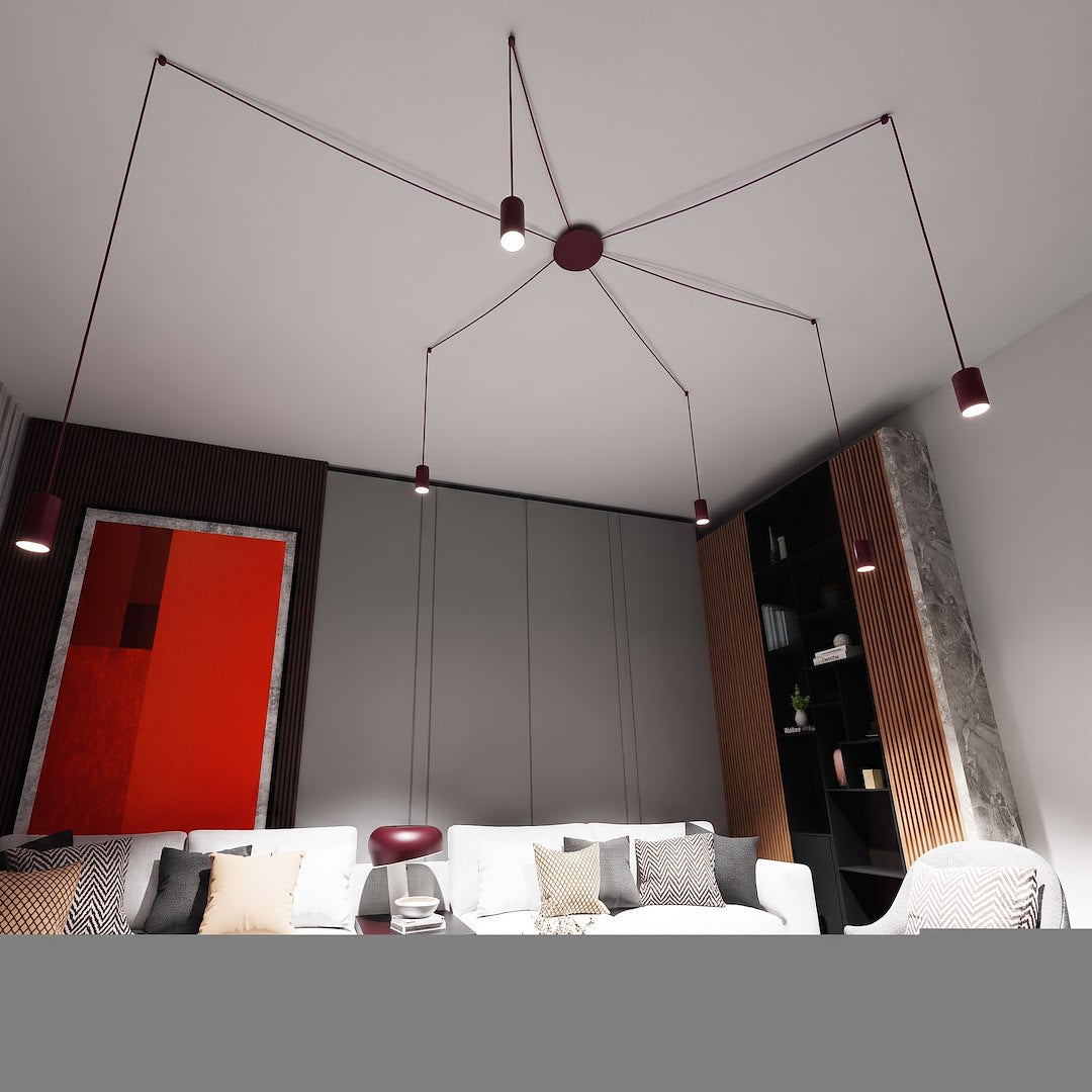 Mise en ambiance au plafond d'un salon contemporain, suspension bordeaux aux six points lumineux suspendus.