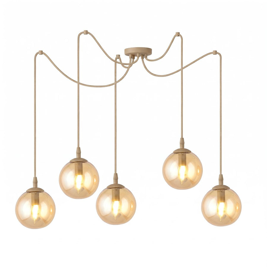Suspension cinq globes de verre ambré suspendus à des câbles beiges, fond blanc