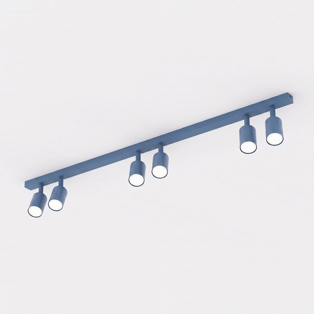 Vue produit de trois quarts, six projecteurs cylindriques bleus alignés sur la barre