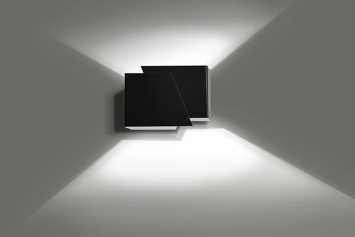 Applique noire vue de face projetant un halo lumineux haut et bas sur mur gris