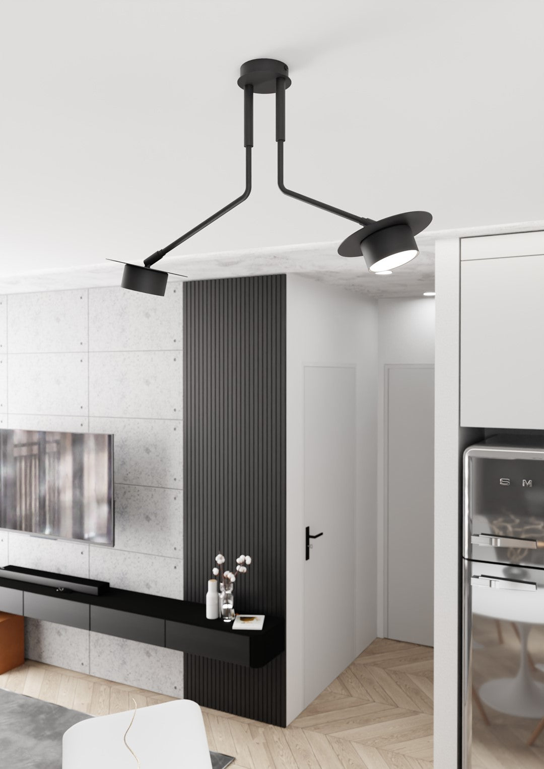Mise en ambiance dans une cuisine contemporaine, suspension noire allumée au-dessus du plan de travail.