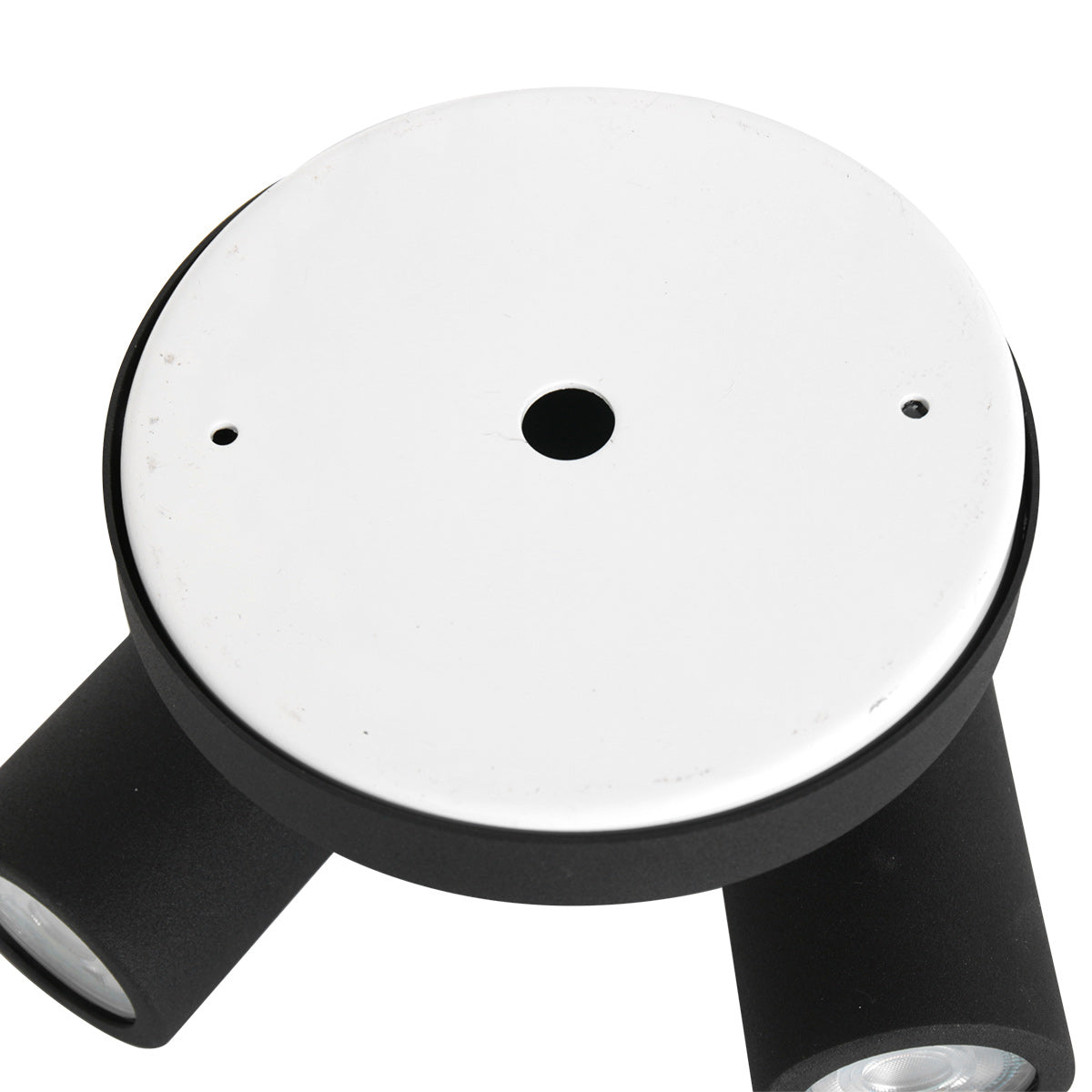 Dessous du socle montrant la platine blanche et le passe-câble central.