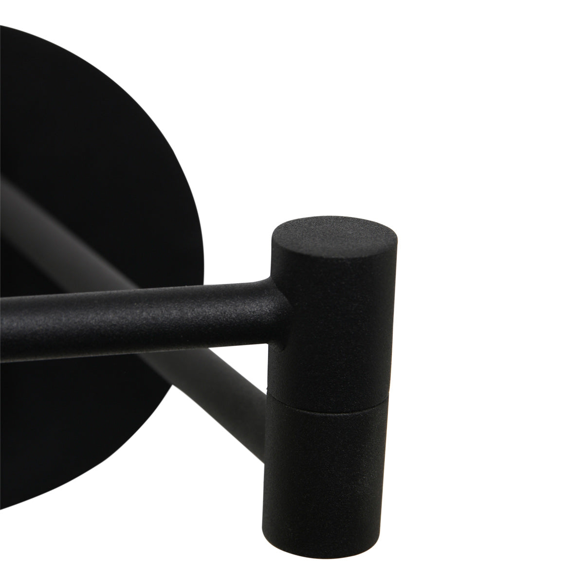Gros plan sur la rotule cylindrique noire reliant les deux bras orientables
