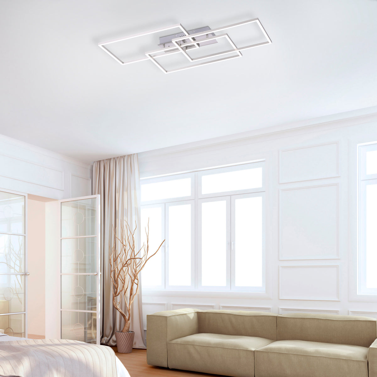 Mise en ambiance dans un salon moderne, plafonnier allumé fixé au plafond blanc.