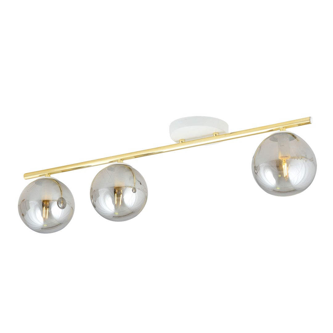 Vue de face du plafonnier trois boules de verre fumé sur barre dorée