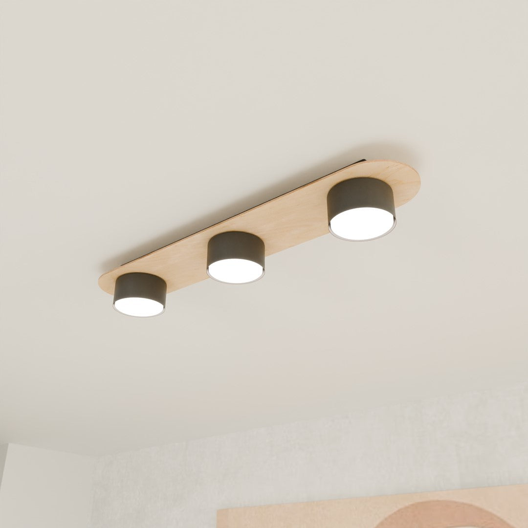 Luminaire installé au plafond blanc, mise en ambiance dans une pièce moderne