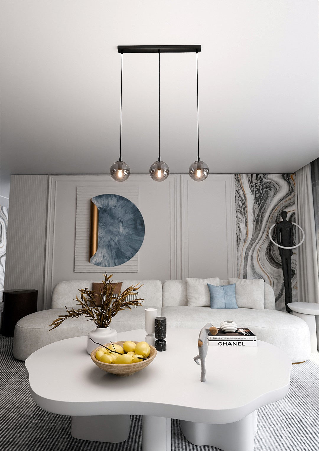 Mise en ambiance salon clair avec la suspension au-dessus d'une table basse blanche