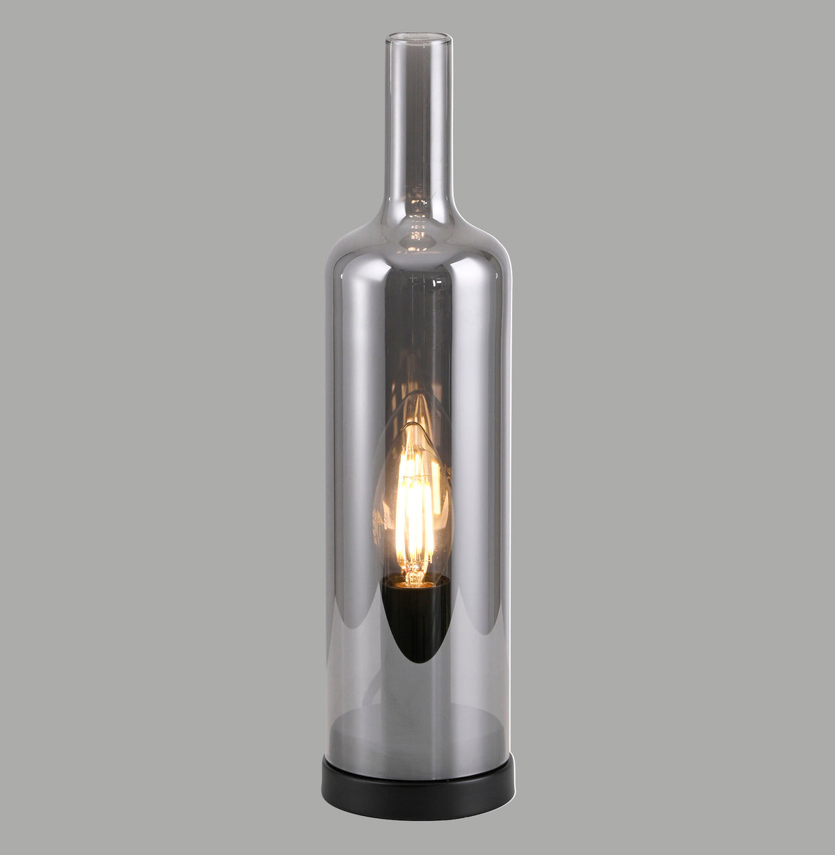 Lampe à poser en verre fumé forme bouteille, ampoule chaude visible, vue de face