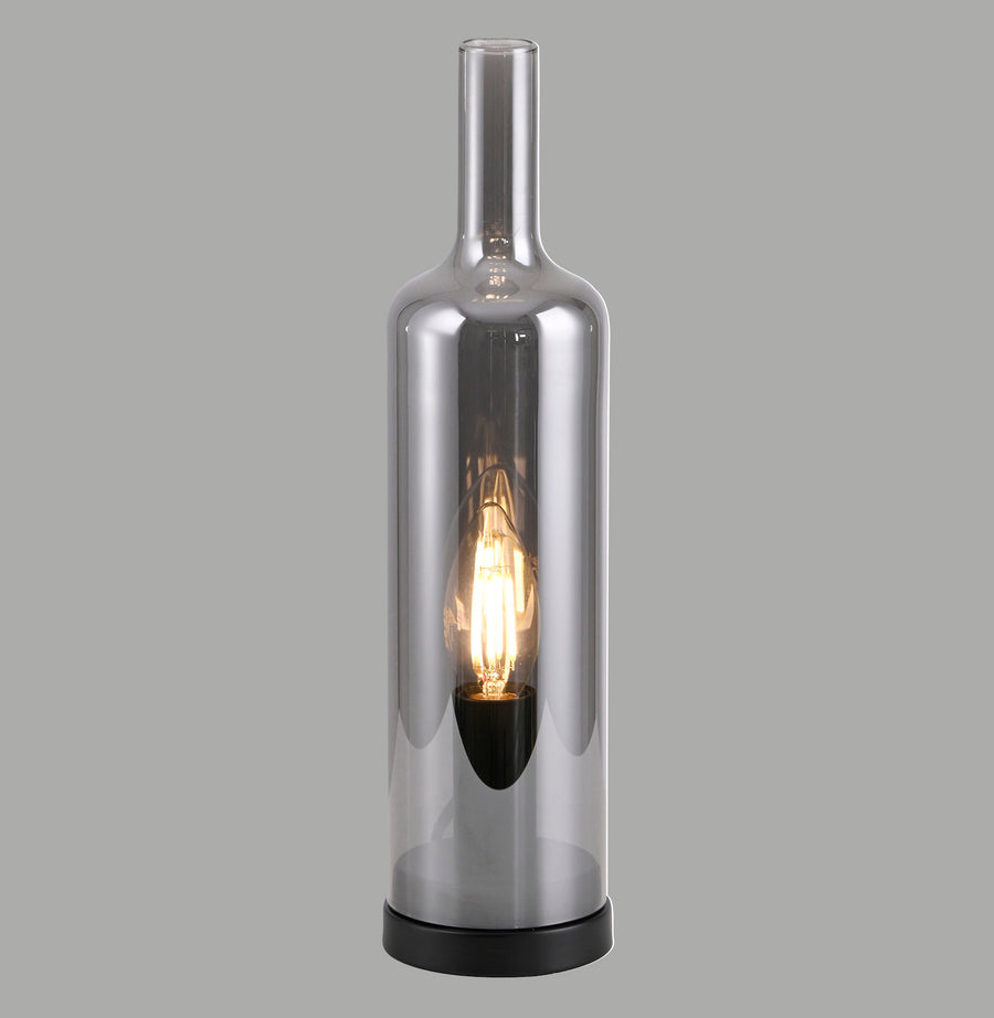 Lampe à poser en verre fumé forme bouteille, ampoule chaude visible, vue de face