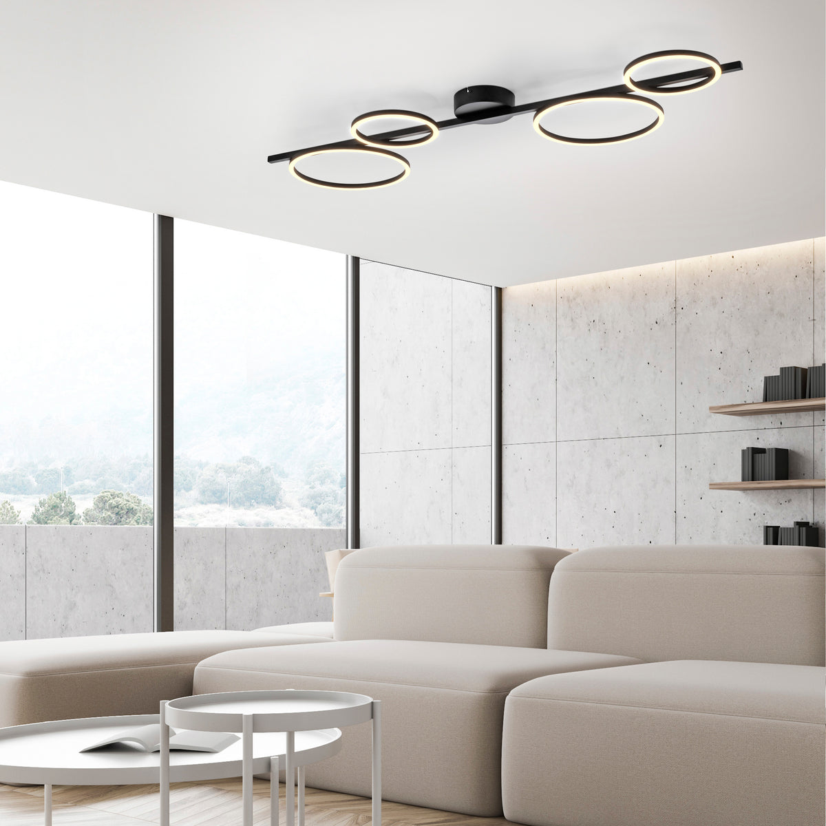 Mise en ambiance dans un salon contemporain, plafonnier noir allumé fixé au plafond.