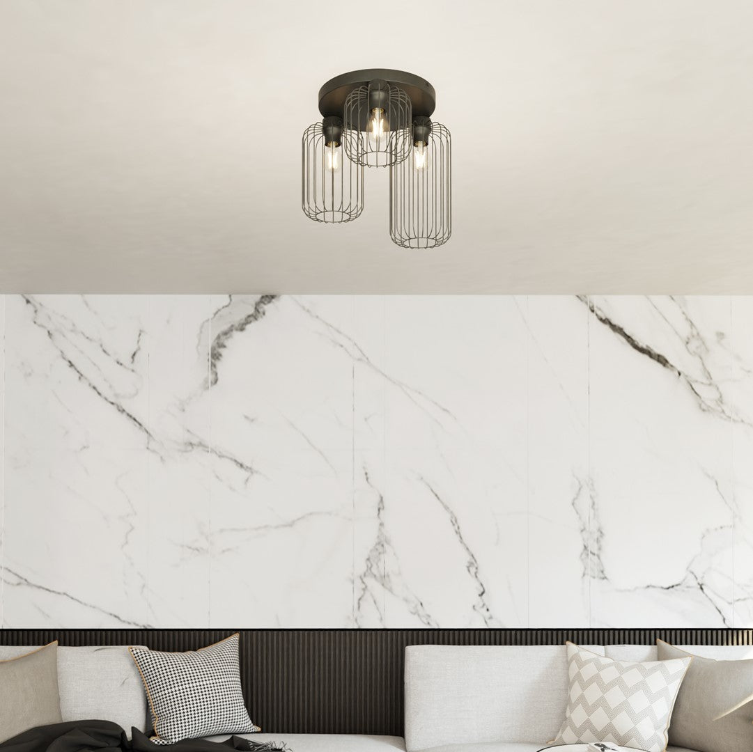 Mise en ambiance du plafonnier au-dessus d'un canapé et coussins décoratifs