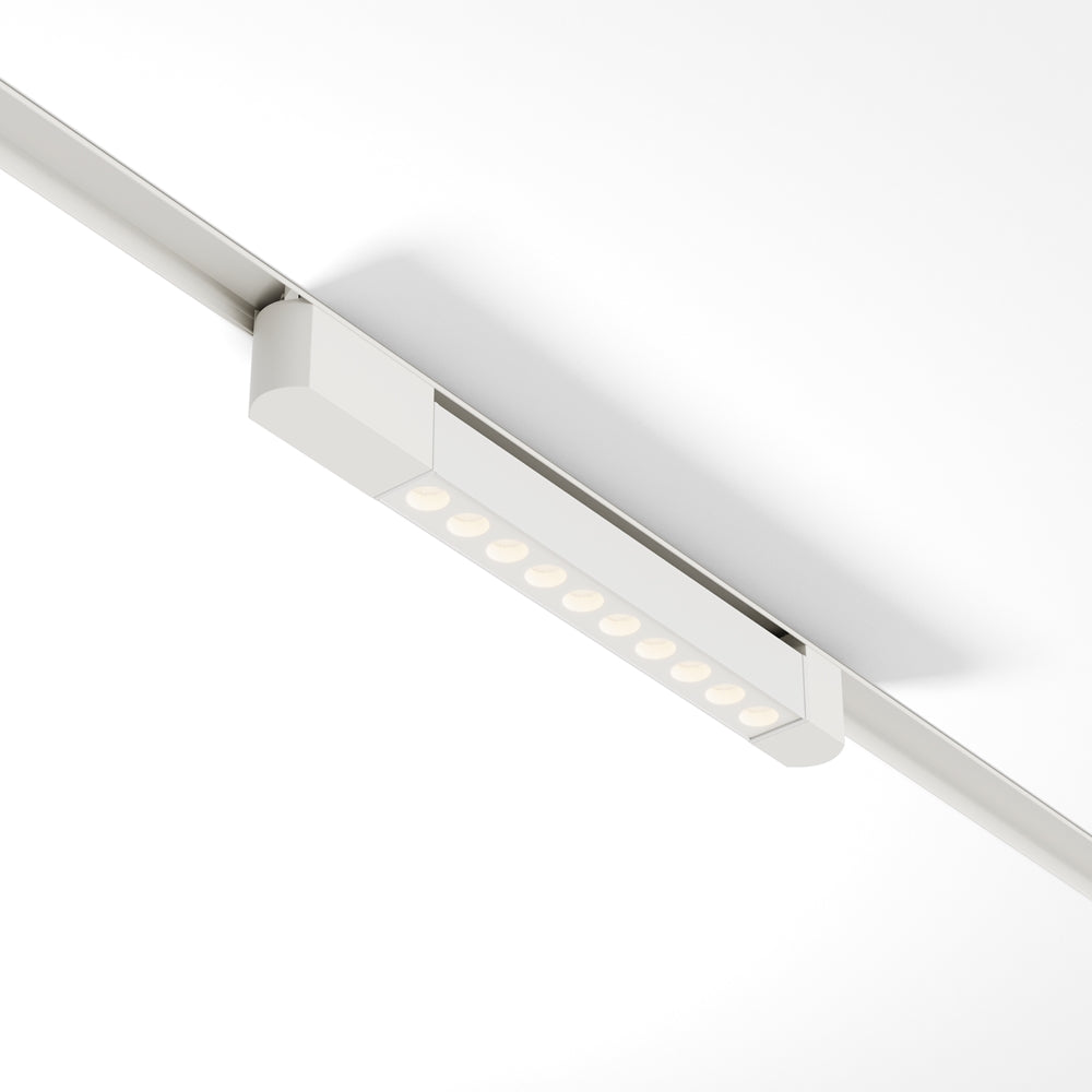 Spot linéaire blanc fixé sur rail, vu de dessous avec ses diodes alignées