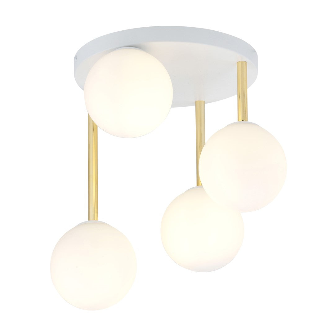 Plafonnier quatre globes de verre opalin suspendus à des tiges dorées sur platine blanche