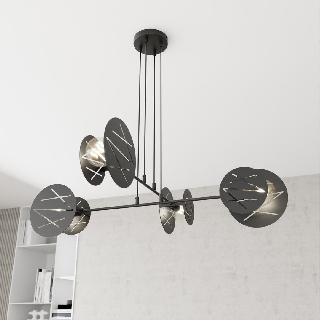 Vue rapprochée du luminaire montrant les disques noirs perforés et les ampoules allumées.