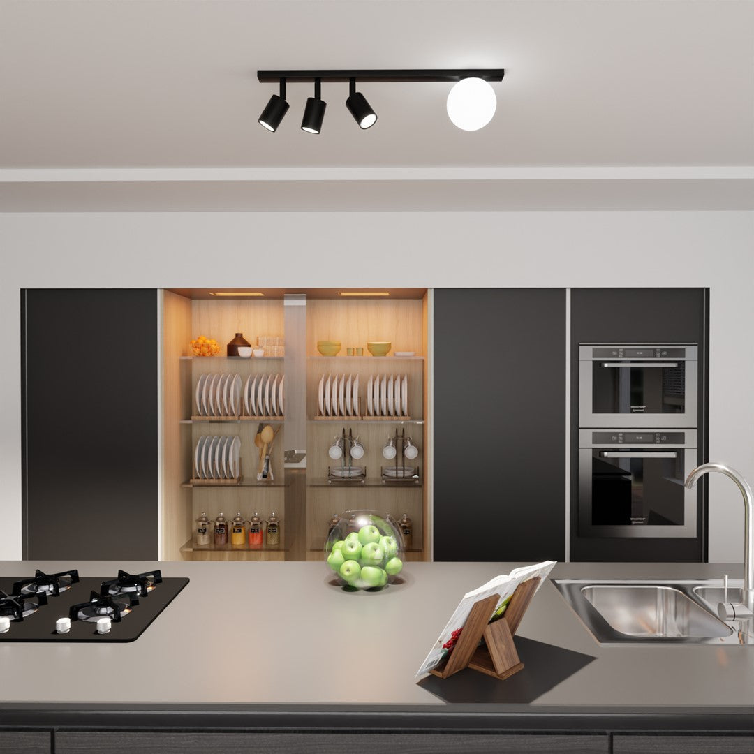 Luminaire installé au plafond d'une cuisine moderne au-dessus du plan de travail.