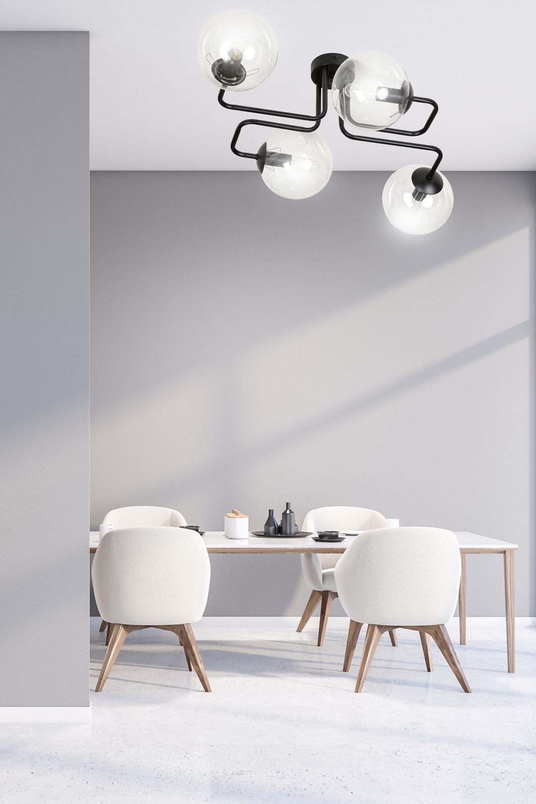 Mise en situation salle à manger, quatre globes éclairés au-dessus d'une table blanche