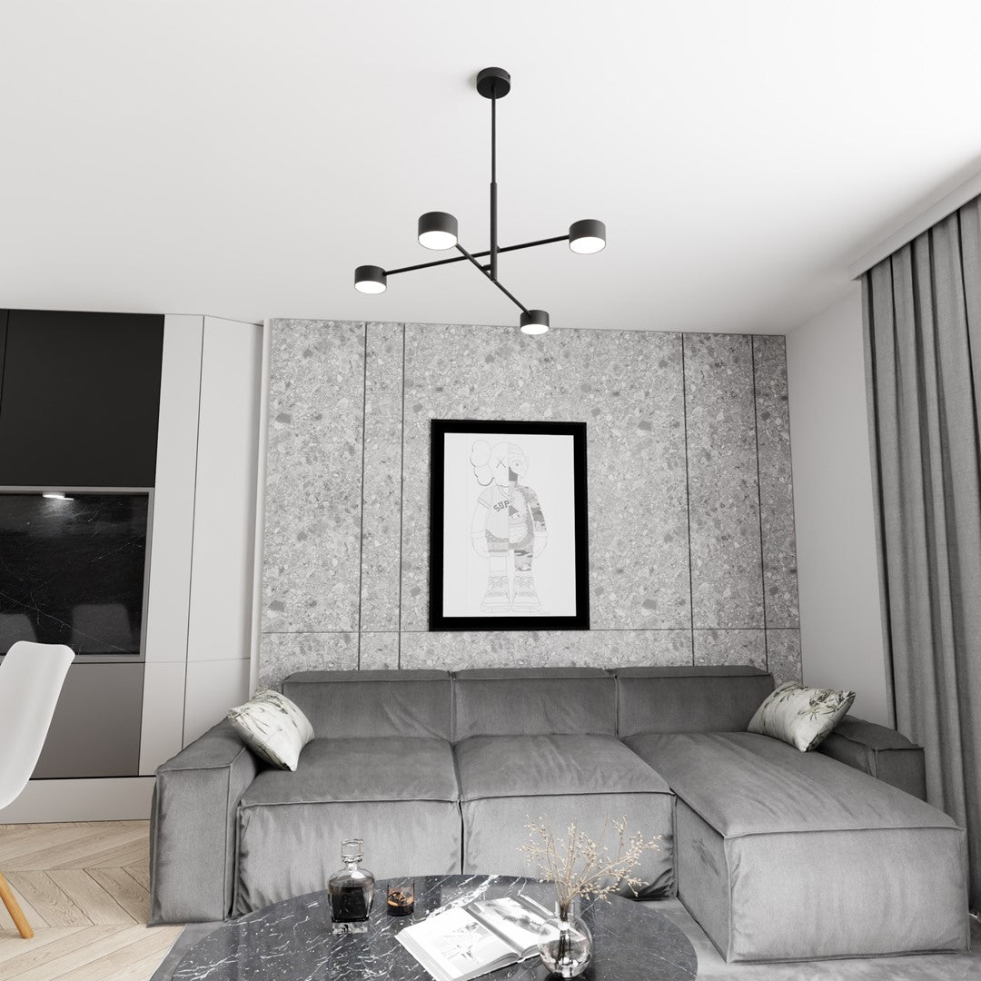 Luminaire suspendu dans un salon gris, au-dessus d'un canapé d'angle et d'une table basse