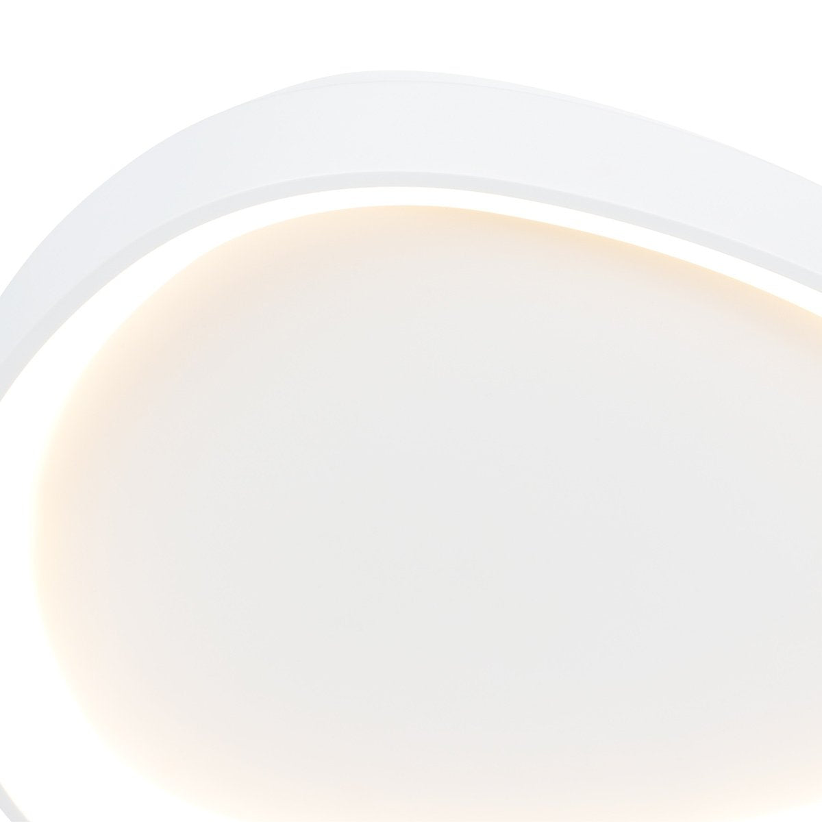 Gros plan du diffuseur allumé, halo lumineux blanc chaud et uniforme