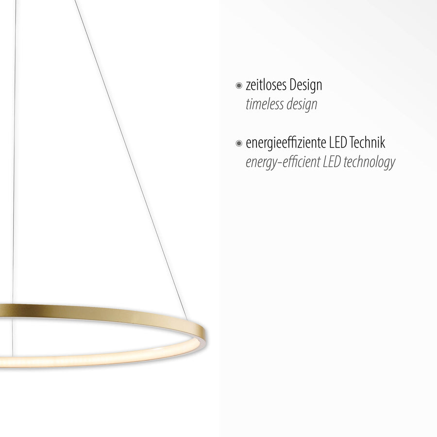 Détail de la finition dorée et du diffuseur LED, avec mentions design intemporel