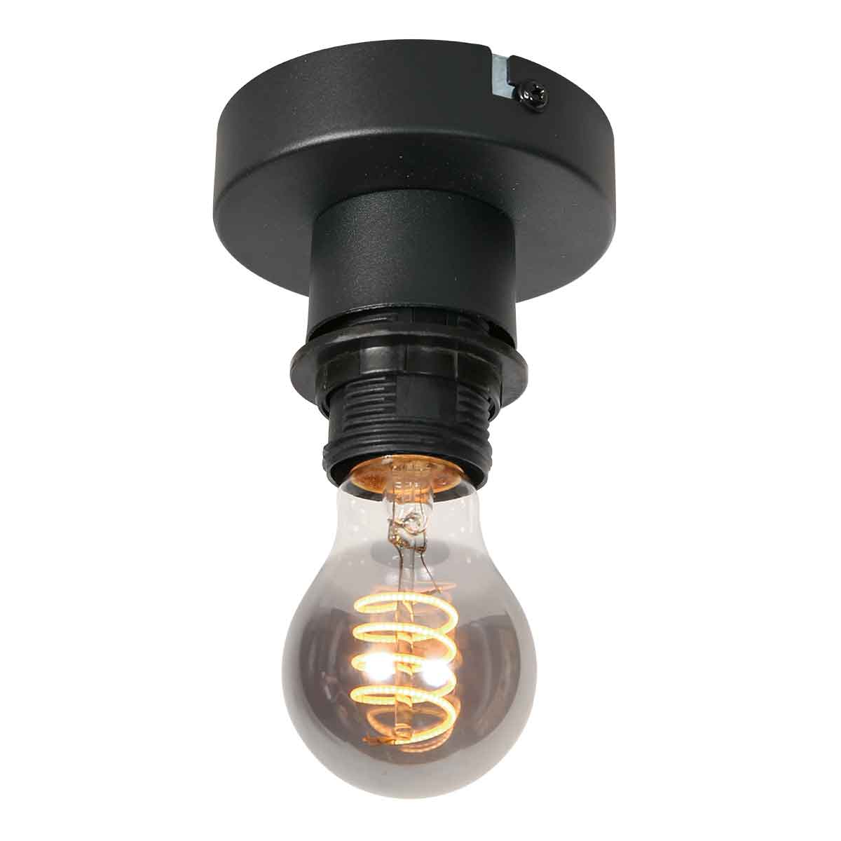 Gros plan de la douille noire équipée d'une ampoule LED filament allumée