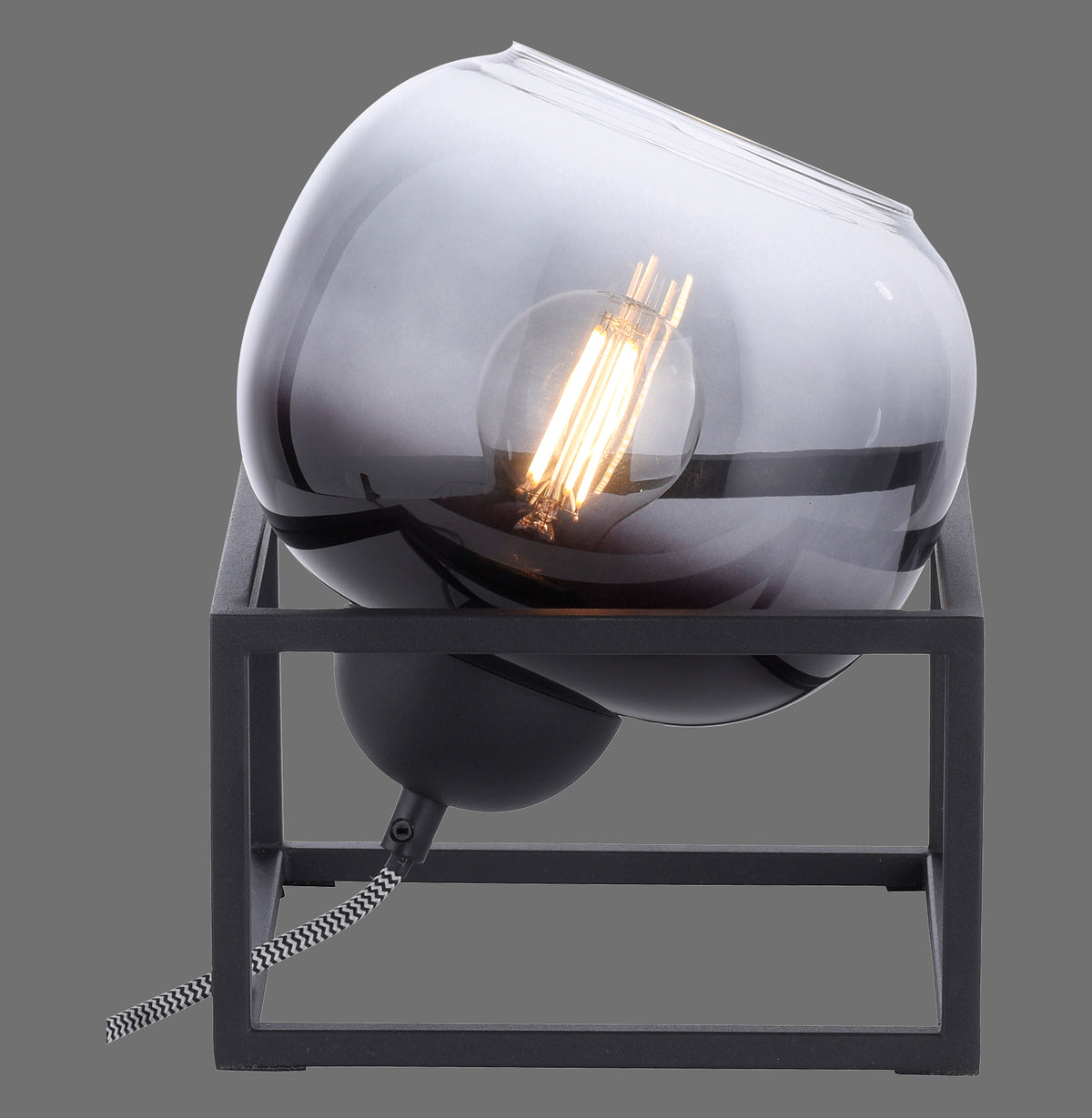 Lampe à poser de face, grand verre fumé sphérique posé sur socle cubique noir