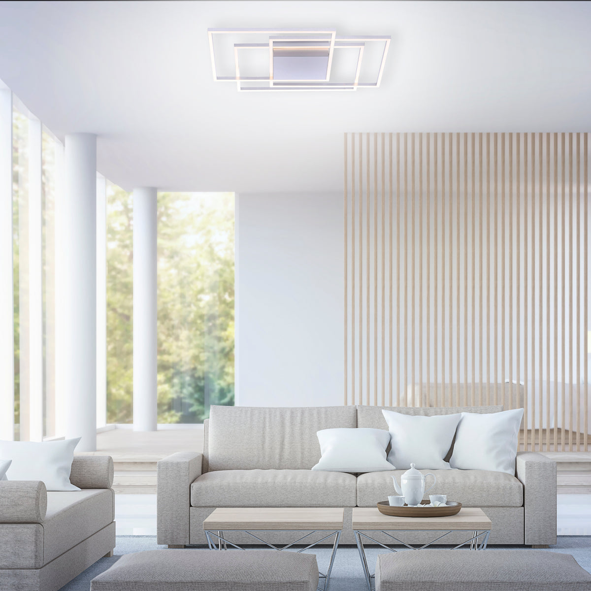 Mise en ambiance dans un salon contemporain, plafonnier allumé fixé au plafond blanc.