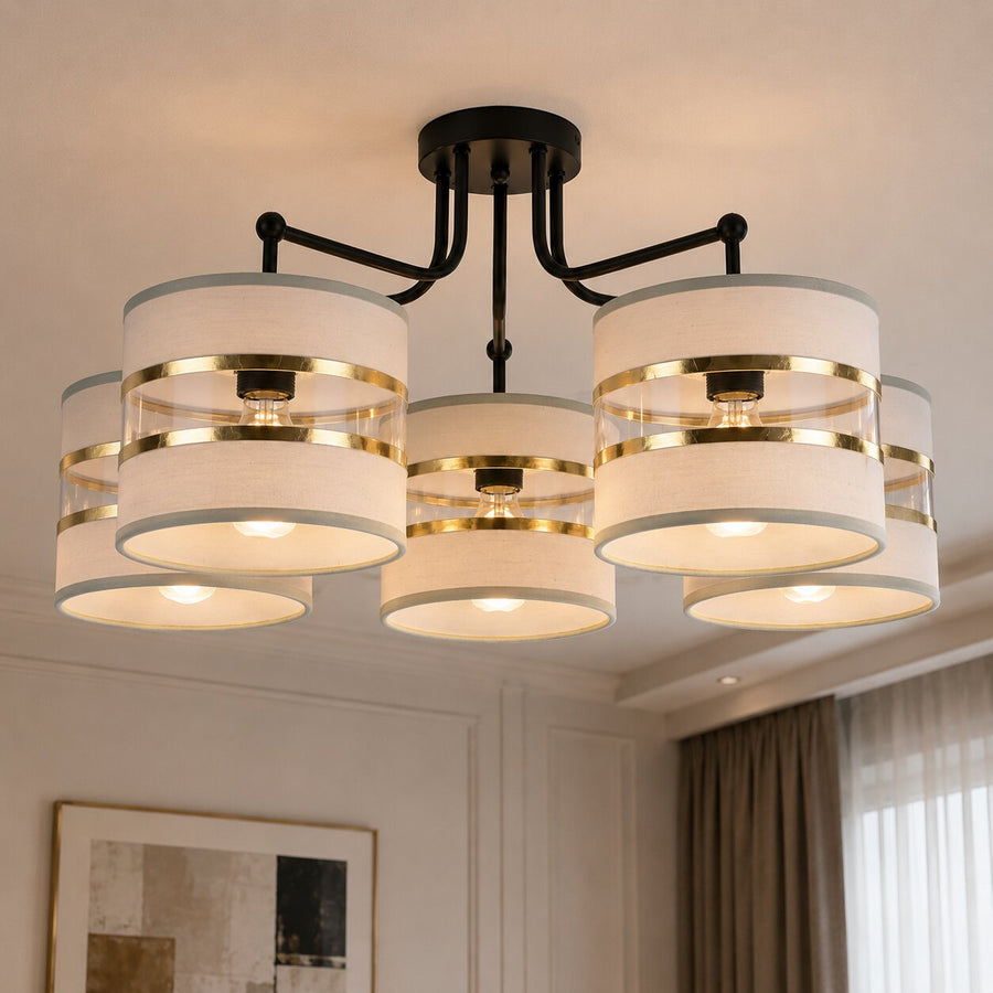 Suspension installée au plafond, cinq abat-jour cylindriques allumés avec cercles dorés.