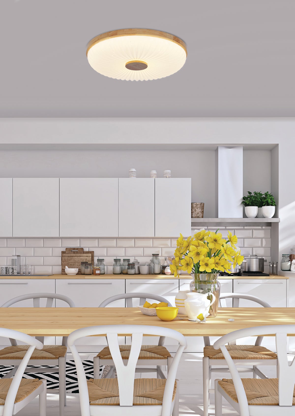 Mise en ambiance cuisine : plafonnier rond allumé au-dessus d'une table à manger.
