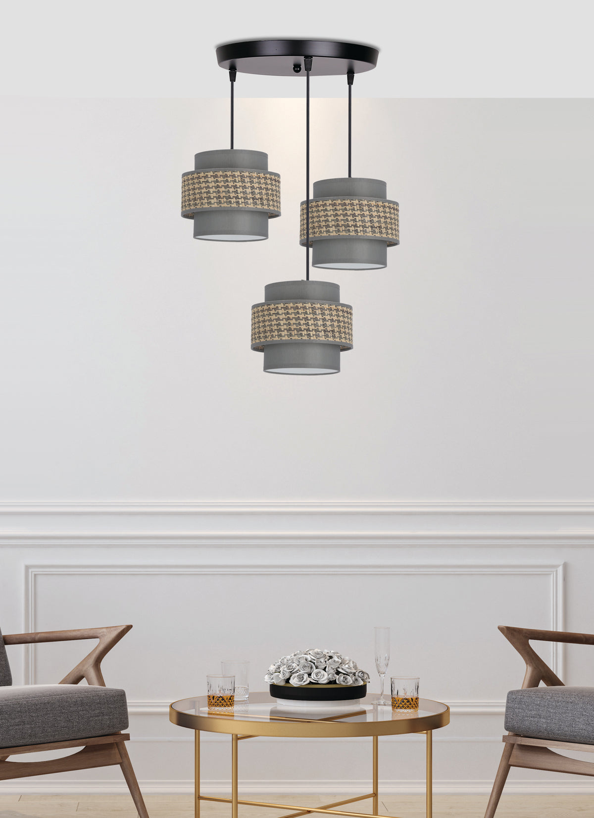 Mise en ambiance du luminaire suspendu au-dessus d'une table basse dans un salon contemporain