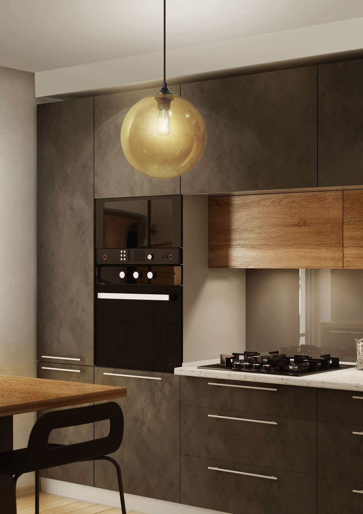 Mise en ambiance cuisine moderne, suspension ambrée allumée au-dessus du plan de travail