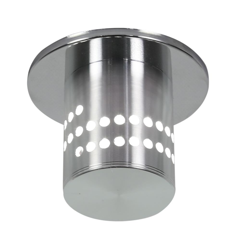 Spot encastrable chromé avec cylindre perforé de points, présenté de face sur fond blanc.