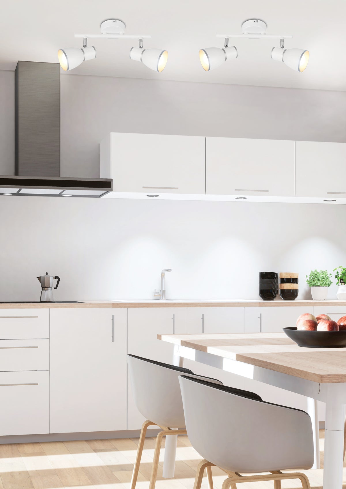 Mise en ambiance cuisine moderne, deux plafonniers blancs fixés au plafond au-dessus du plan de travail