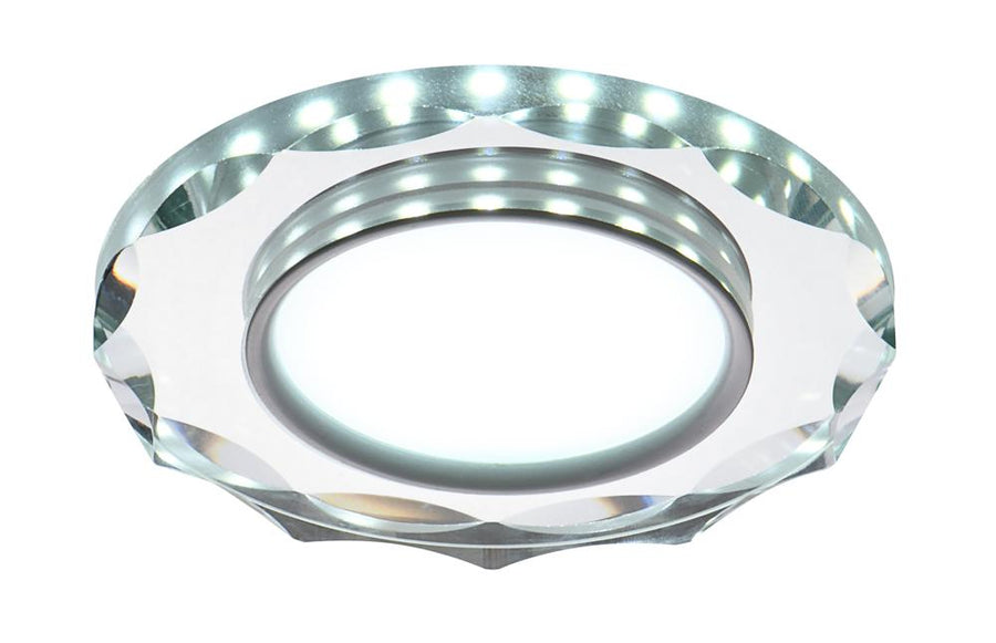 Vue de face du spot LED rond avec anneau transparent facetté et diffuseur blanc central.