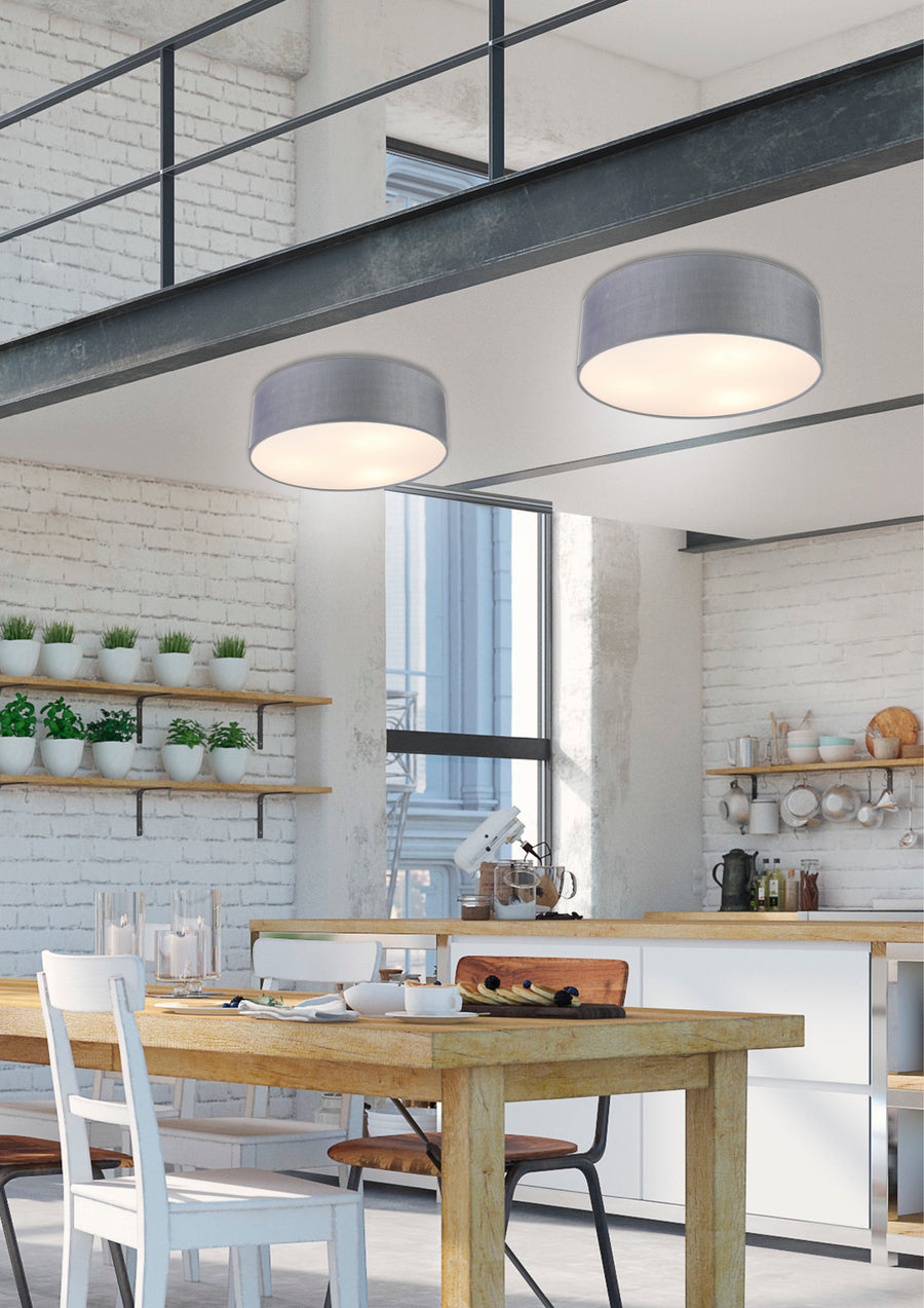 Deux luminaires gris clair éclairant une cuisine moderne à briques blanches