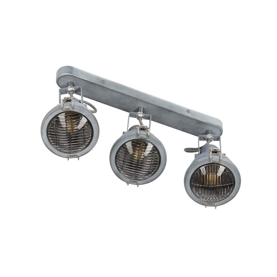 Vue plongeante montrant les trois projecteurs pivotants et leur grille avant