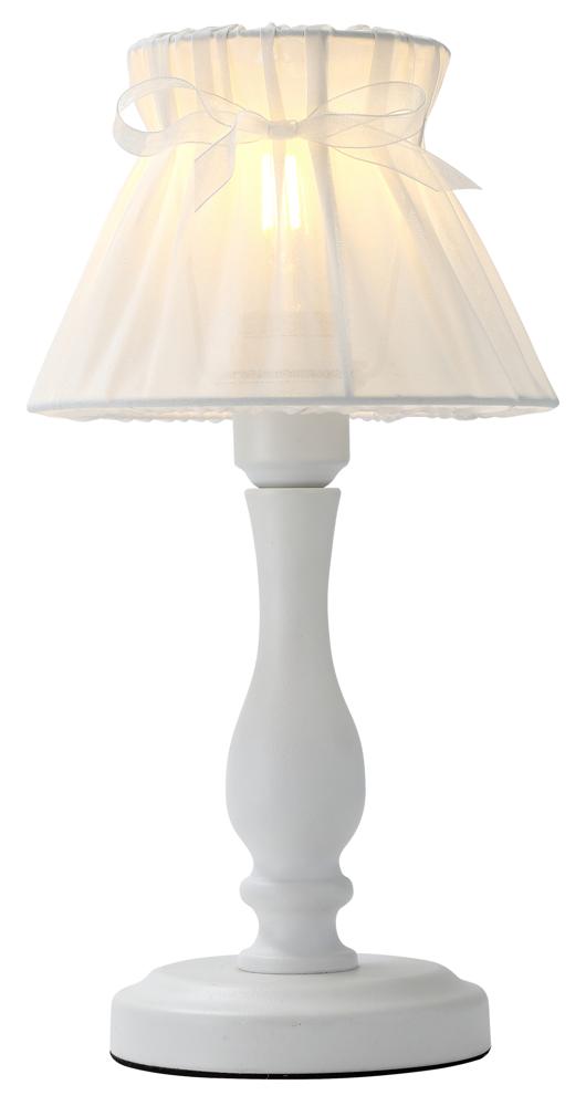 Lampe à poser allumée, vue de face, abat-jour plissé blanc avec nœud en ruban.