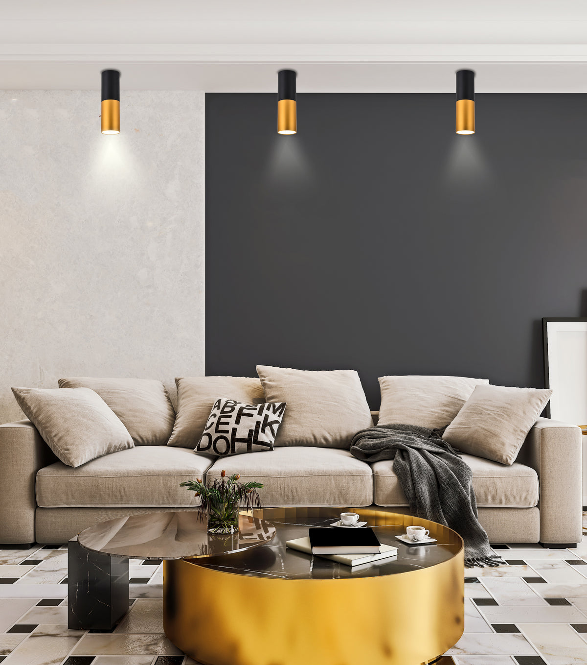 Ambiance intérieure montrant les spots allumés au-dessus d'un canapé gris et coussins.