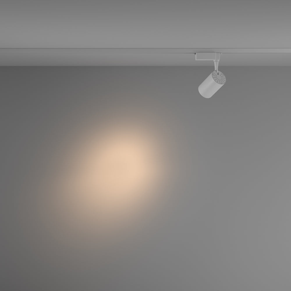Mise en ambiance montrant un halo de lumière chaude projeté sur un mur gris.