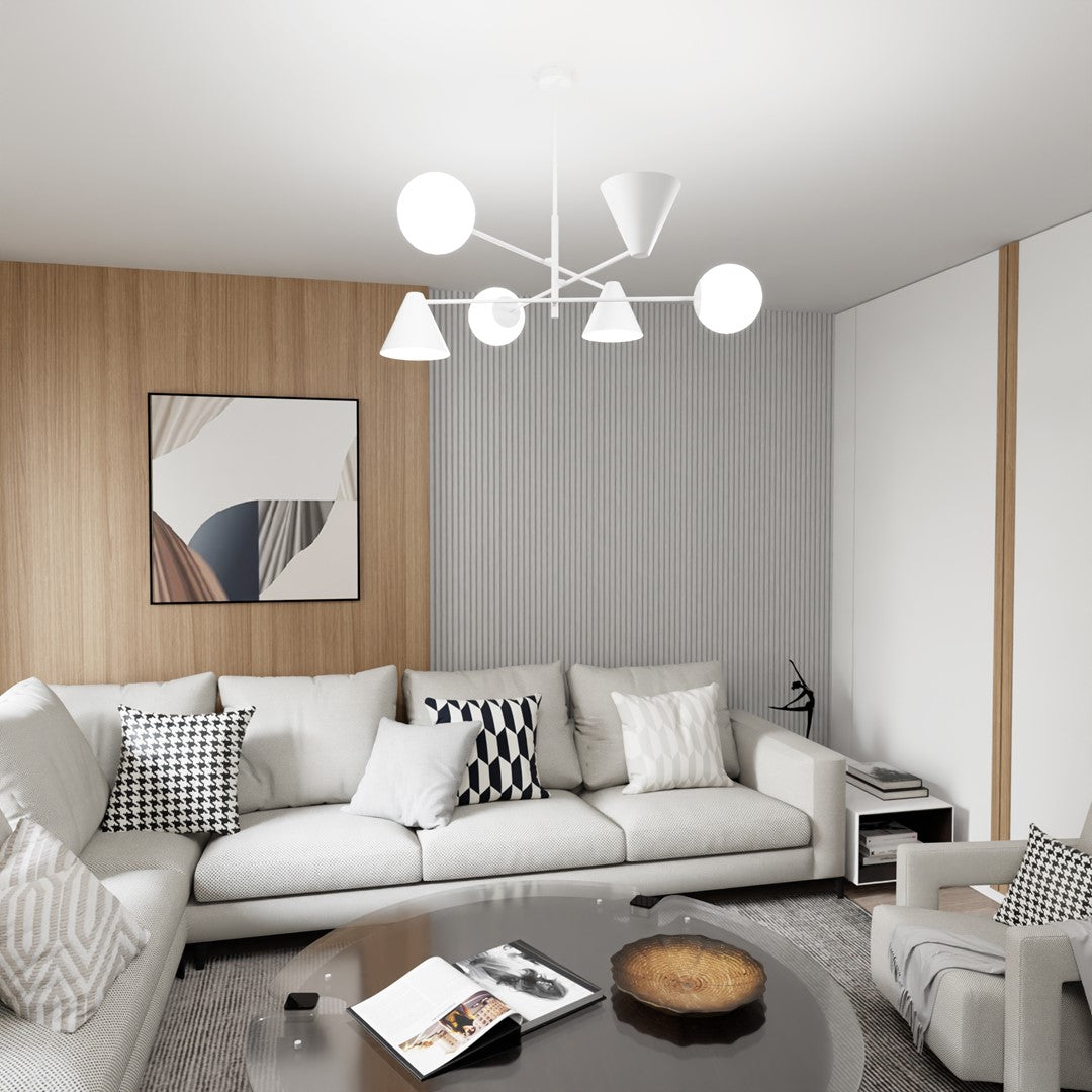 Mise en ambiance du luminaire blanc suspendu au-dessus d'un salon avec canapé et tableau