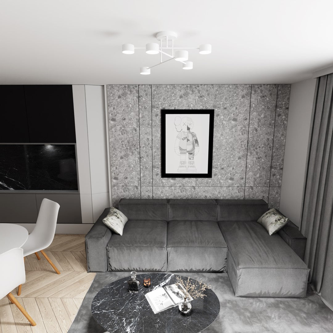 Plafonnier blanc éclairant un salon gris avec canapé d'angle et tableau