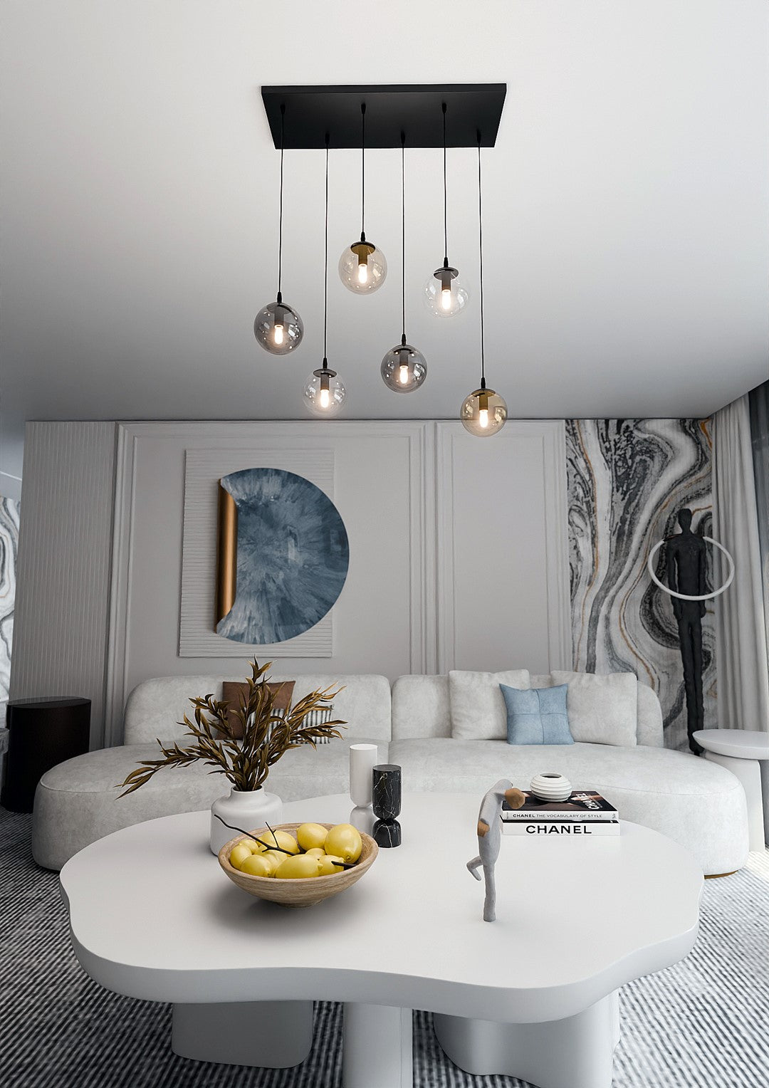 Mise en ambiance salon clair, suspension allumée au-dessus d'une table basse blanche