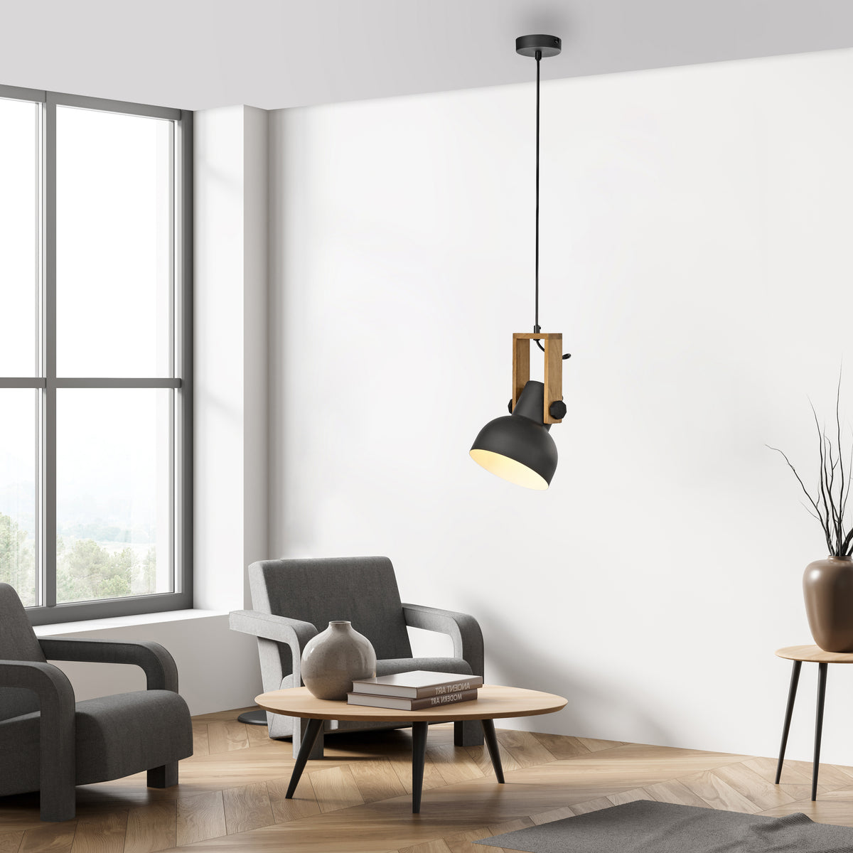 Mise en ambiance du salon moderne avec la suspension allumée près d'un fauteuil.