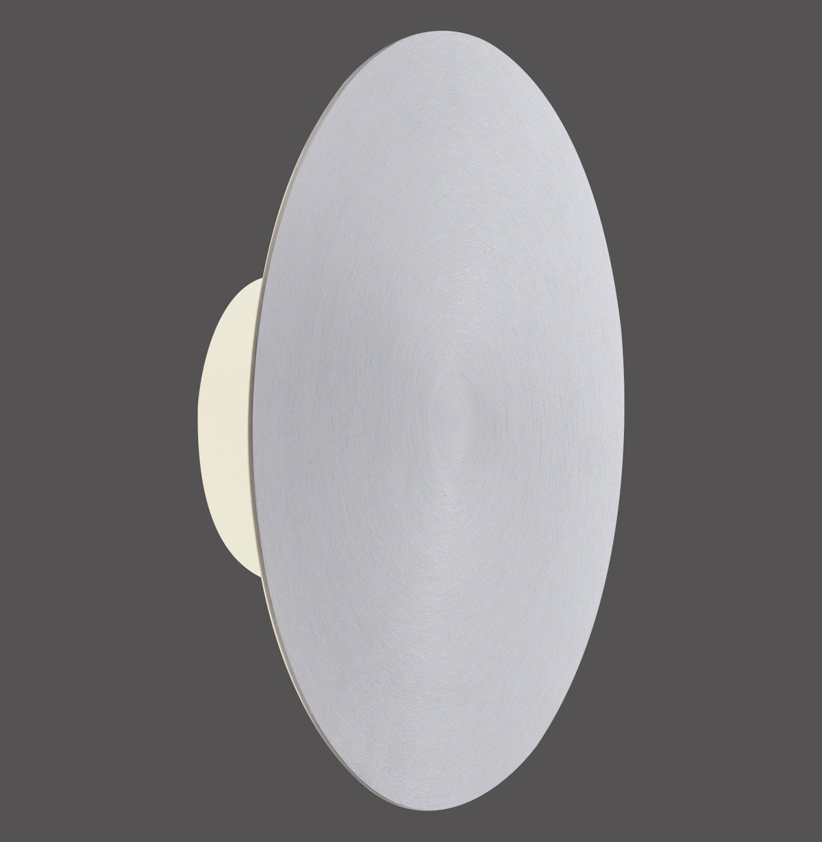 Vue de profil sur fond gris de l'applique murale ronde en aluminium allumée.