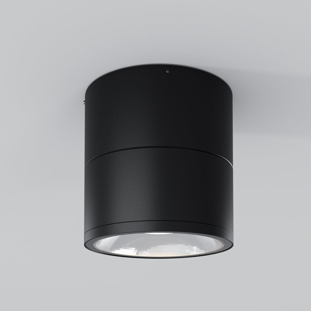 Vue de face du spot cylindrique noir fixé au plafond, lumière éteinte